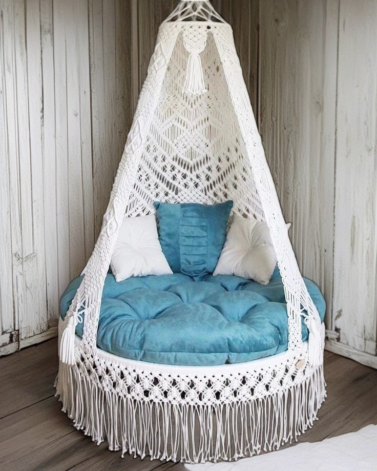 White macrame swing with blue mattress for home